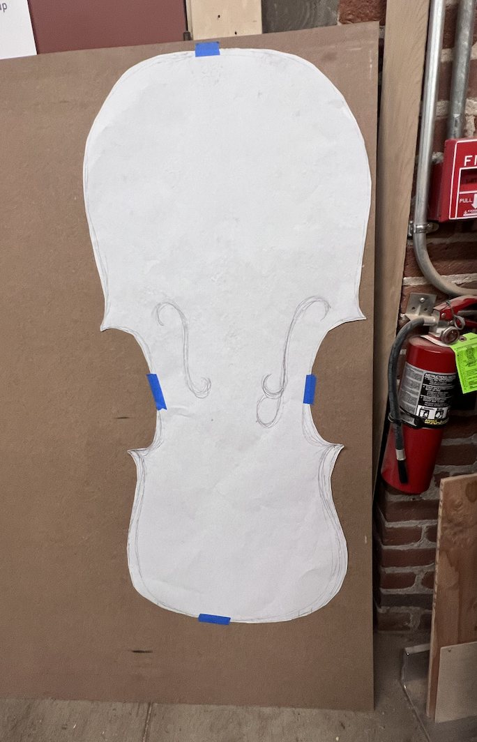 Full-size paper template of the violin-shaped table top
