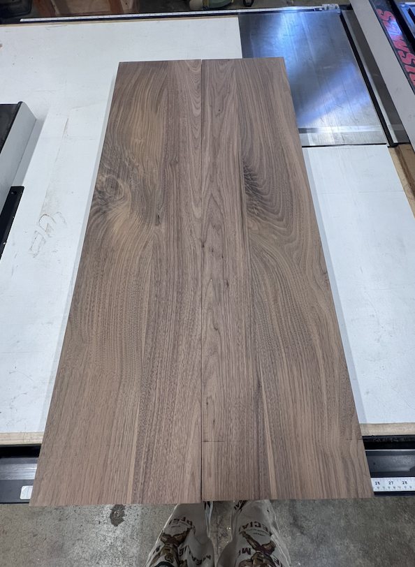 Two walnut boards ready to be glued together