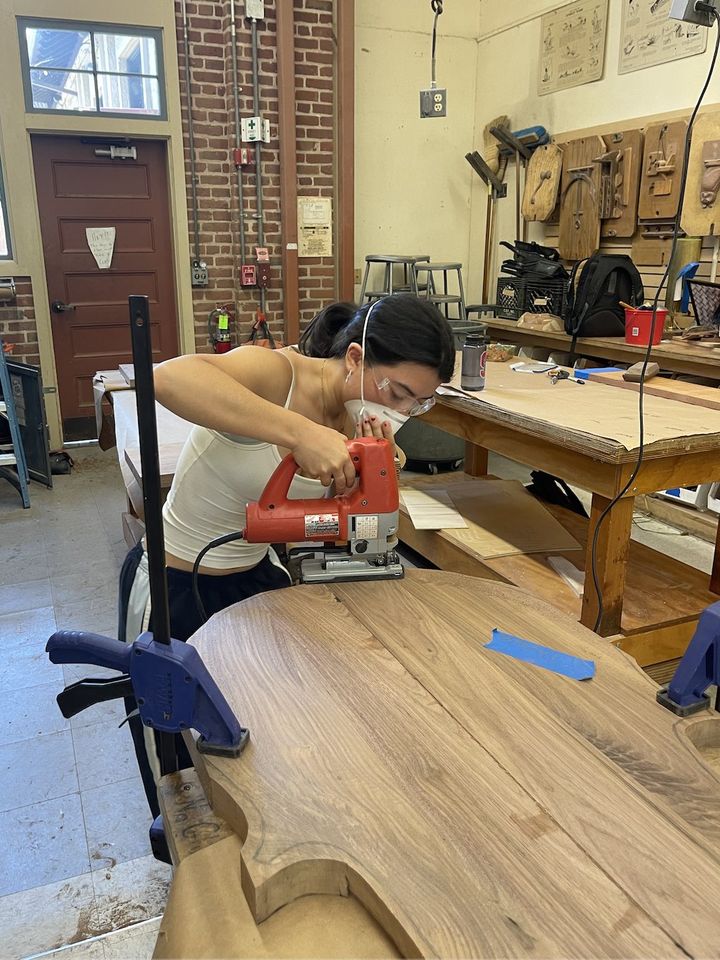 Symphony cutting the walnut table top with a jigsaw