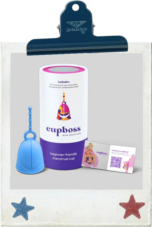 CupBoss: a blue menstrual cup next to its purple and white CupBoss packaging